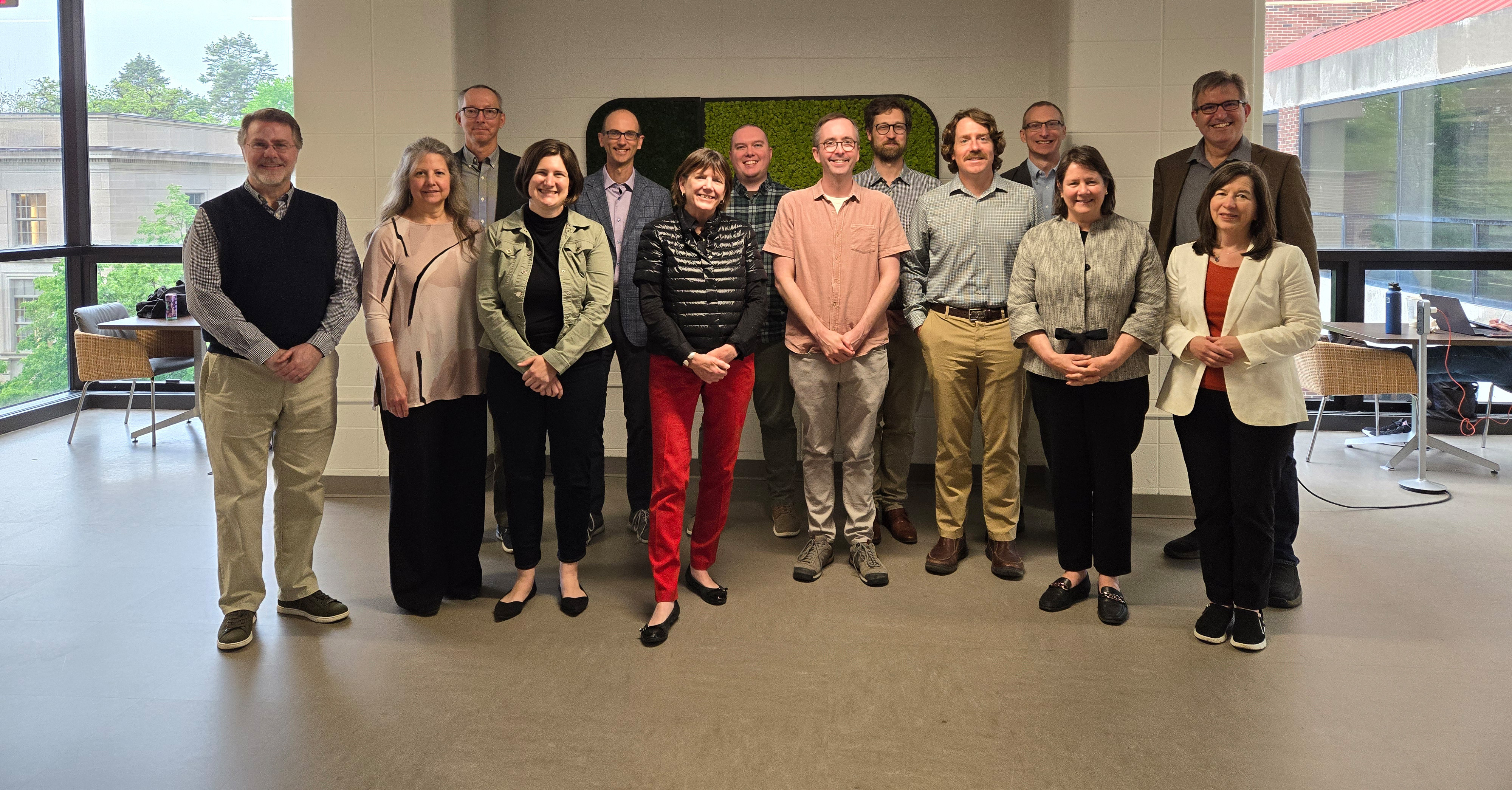 Group photograph of Lever Press Oversight Committee's 14 members.